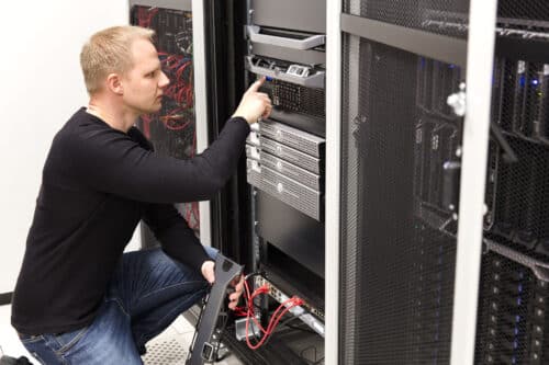 it technician working on a server