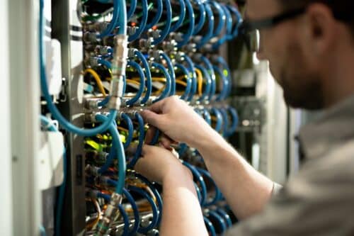 Worker installing structured cabling